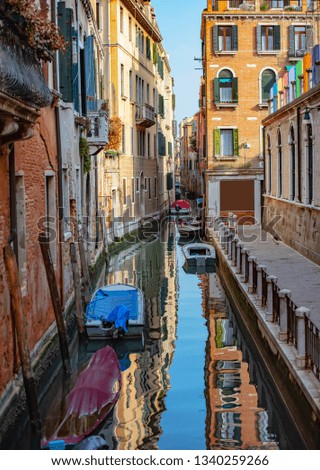 Parked boats. Beautiful Canal in Venice Italy