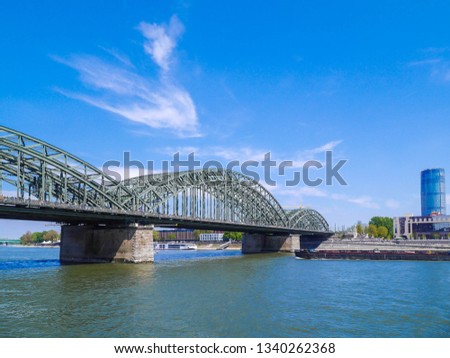 Hohenzollern Bridge  is a bridge crossing the river Rhine in the German city of Cologne. Four equestrian statues of Prussian kings and German emperors of the Hohenzollern family flank each ramp