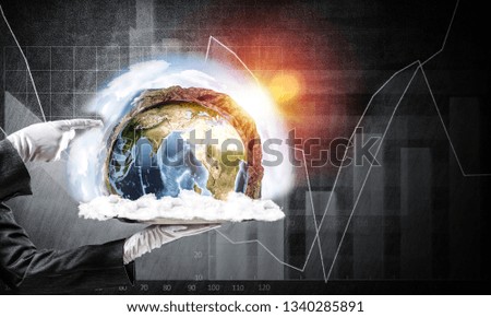 Cropped image of waitress's hand in white glove presenting Earth globe on metal tray and pointing on it with dark wall on background. 3D rendering. Elements of this image are furnished by NASA.