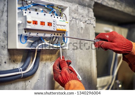 Maintenance of the electrical system. Work tests of the electrical circuit. Royalty-Free Stock Photo #1340296004
