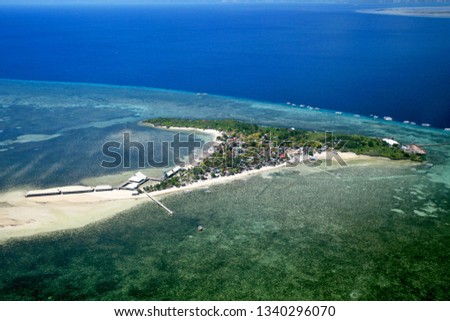A view from the air of Hilutnagan Island near Cebu, Philippines. Royalty-Free Stock Photo #1340296070
