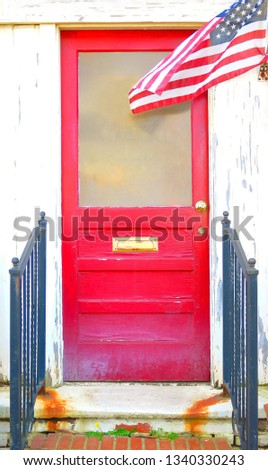 Patriotic Red Door on Old Weathered Building