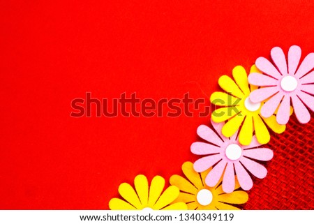 gift card with red background and ribbon band with many multicolored flowers and plenty copy space for the text