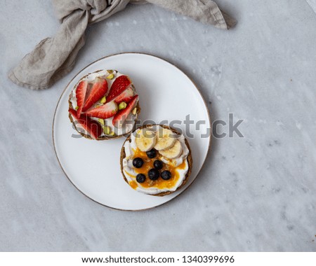 Fruit sandwiches with vegan ricotta cheese on marble background. view from above with copy space