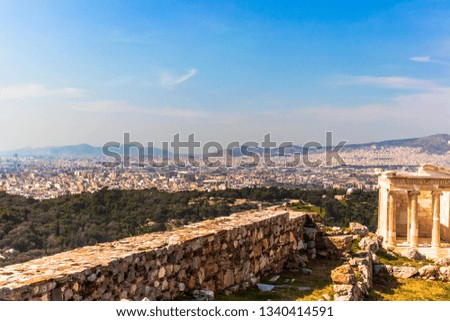 Landscape photo from the top of Acropolis, Athens, Greece, with part of the temple columns.