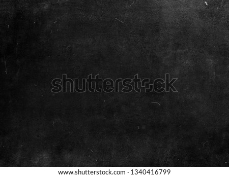 Black grunge scratched background, old film effect, chalkboard texture
