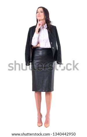 Beautiful charming stylish business woman in modern clothes with finger on chin thinking. Full body isolated on white background.