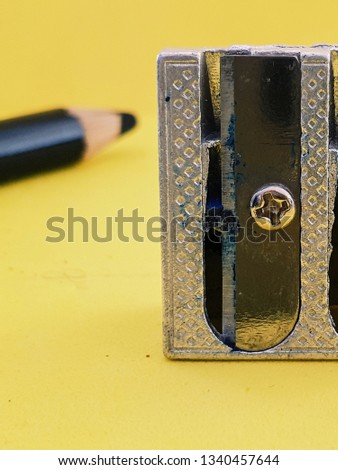 pencil sharpener on yellow background 
