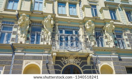 Wonderful Atlantes, on the facade of the Jewish House. Detail of art nouveau architecture, building in Chernivtsi Bukovina Ukraine (City culture palace - former national jewish h