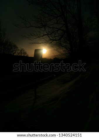 picture of the sun rising in the winter time