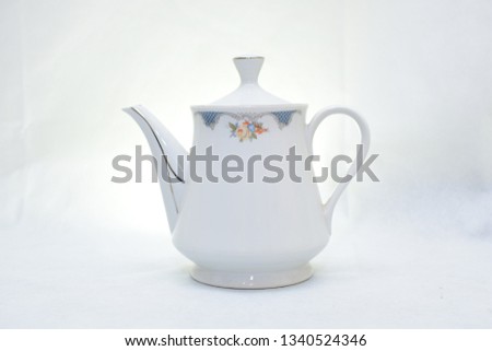 elegant and traditional colorful white and blue teapot  , design/ drink-ware isolated on white background