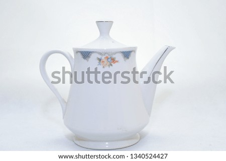 elegant and traditional colorful white and blue teapot , design/ drink-ware isolated on white background