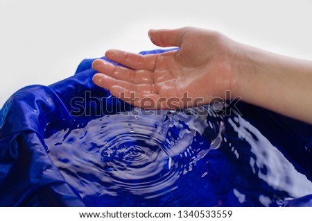 Children's hands in water and with water.
