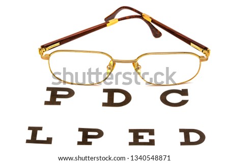 Glasses are on the table for eye examination. Isolated image.