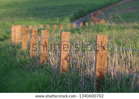 hiking trail with green fields and fence at Quail Hill Loop Irvine California, USA