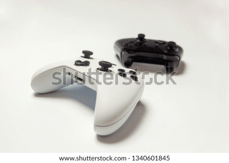 White and black two joystick gamepad, game console isolated on white background. Computer gaming technology play competition videogame control confrontation concept. Cyberspace symbol