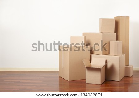 Moving day, cardboard boxes in apartment Royalty-Free Stock Photo #134062871