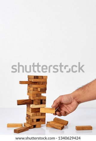 Businessman Building Up Tower, Challenge In Business Concept