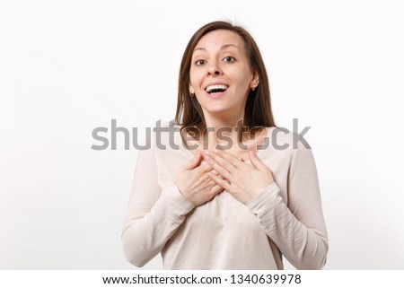 Portrait of surprised amazed young woman in light clothes keeping mouth open pointing hands on herself isolated on white wall background. People sincere emotions lifestyle concept. Mock up copy space