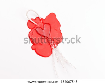 mark in the shape of a heart made of red sealing wax
