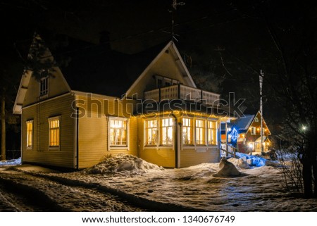 Village house in winter night