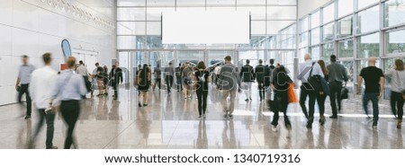 large Crowd of anonymous business people walking, with copy space banner