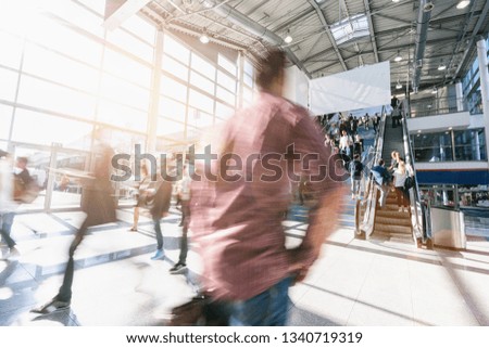 crowd of blurred business people at a trade show
