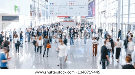 blurred business people at a trade fair Royalty-Free Stock Photo #1340719445