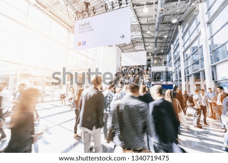 blurred business people at a trade fair