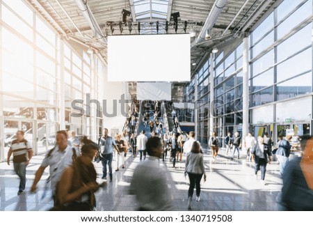 crowd of blurred business people, with copy space banner