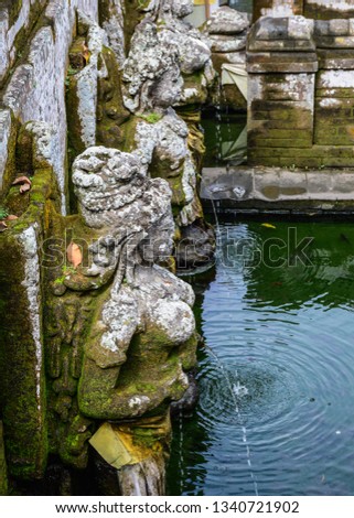 Apsara statues at ancient temple in Bali, Indonesia. Bali is a lush island paradise famed for its art culture and recreation.