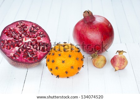 tropical fruits, herbs and spices on rustic wooden table
