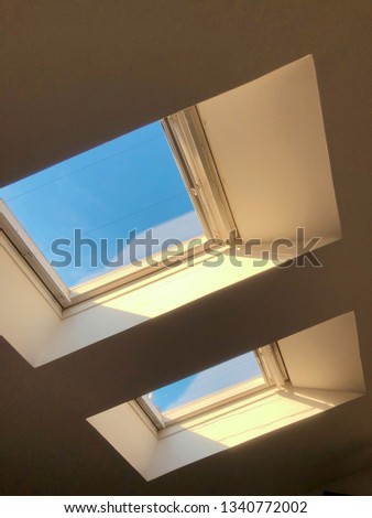 A window with a bright sky.