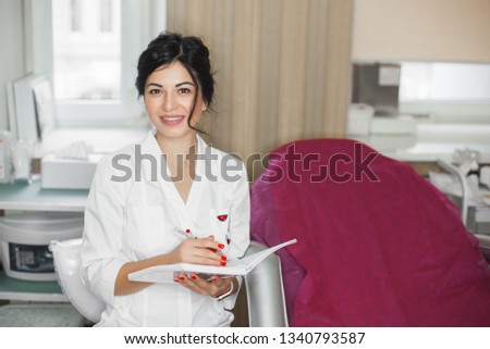Young woman in cosmetological parlor. Dermatologist in beauty parlor. Doctor in the clinic. Closeup portrait of dermatologist.
