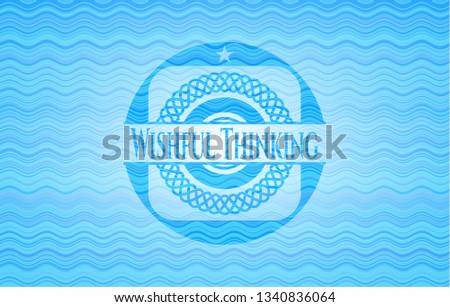 Wishful Thinking light blue water style badge.