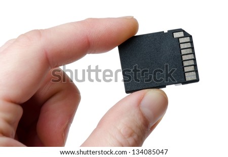  memory card in a hand on a white background