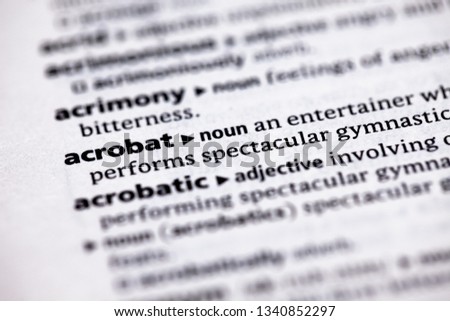 Blurred close up to the partial dictionary definition of Acrobat