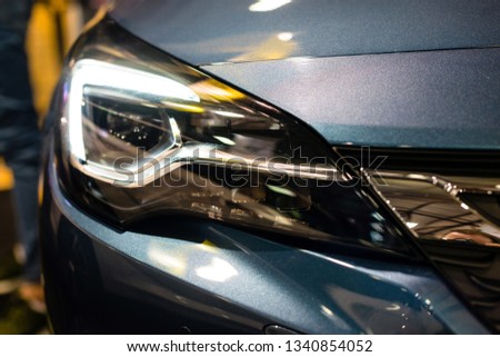 Car headlight with backlight. Exterior detail.White color car - image