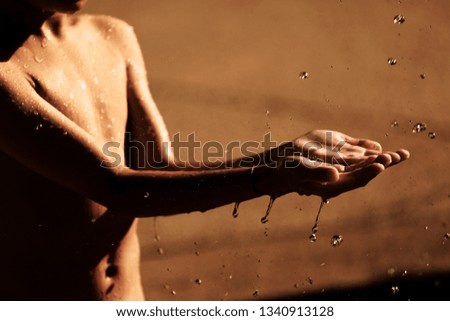 Water flows on the kid hands.