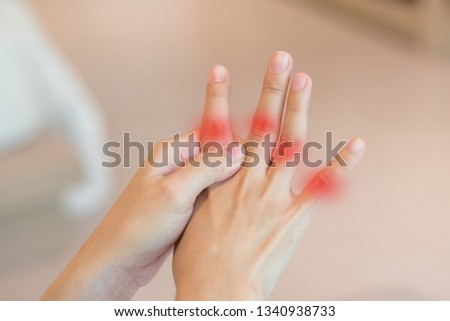 Overuse hand problems. Woman’s hand with red spot o fingers as suffer from Carpal tunnel syndrome. The symptoms of tingling, numbness, weakness, or pain of the fingers and wrist. 