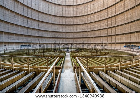 Charleroi, Belgium - 02 13 2019: Interior architecture view of a abandoned cooling tower in power plant of charleroi in Belgium Royalty-Free Stock Photo #1340940938
