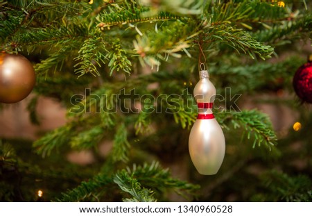 glass bowling pins as decoration on a Christmas tree