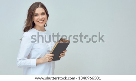 woman teacher or businesswoman holding book. isolated studio portrait.
