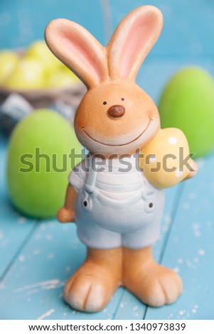Traditional Easter holiday bunny and eggs on white background