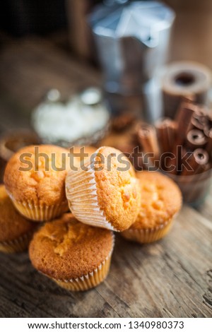 Homemade pastries - portion muffins on a wooden table. Simple cooking. Portion biscuit cupcakes.