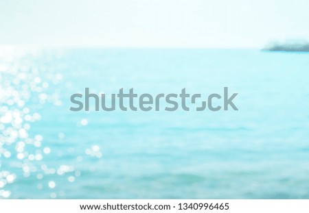 Blur tropical beach with bokeh sun light wave abstract background, Travel concept