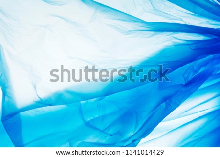 Blue plastic bag texture. Blue plastic film background. Backgraund plastic texture.