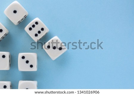 Arrow up. White gaming dices on light blue background. victory chance and lucky. Flat lay style, place for text. Top view and Close-up cube. Concept business and game. Spectacular background pastel.