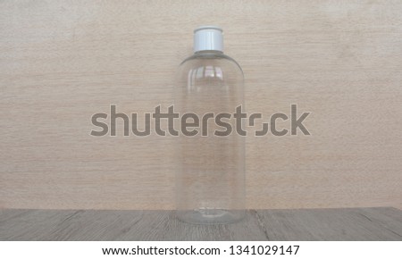 Clear bottle on a light background.