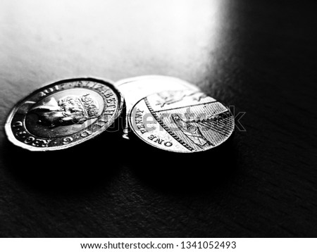 Beautiful closeup macro bokeh background artistic black and white abstract unique style Photos of Coins pound penny.